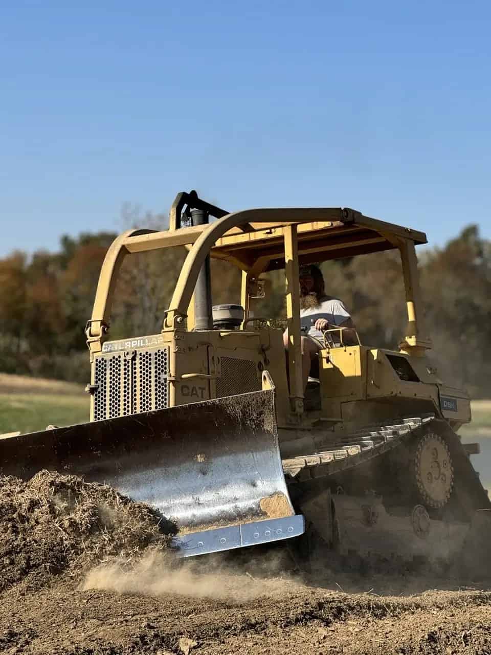 Watch as the bulldozer moves tons of earth, transforming the landscape with raw power and precision.